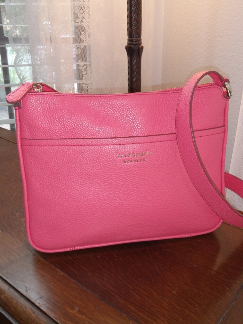 Pink pebbled leather Kate Spade Run Around Medium Crossbody bag in Peach